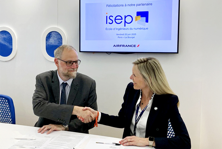 Official signing of a chair partnership between Isep, Graduate School of Digital Engineering, and Air France at the 2025 Paris Air Show. An Isep representative and an Air France representative shake hands in front of a screen displaying the Isep logo and the message: “Congratulations to our partner.”